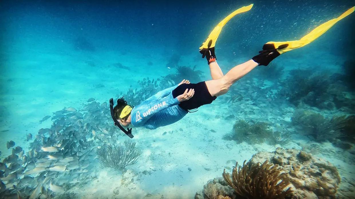 Snorkeling in clear Belize reef waters